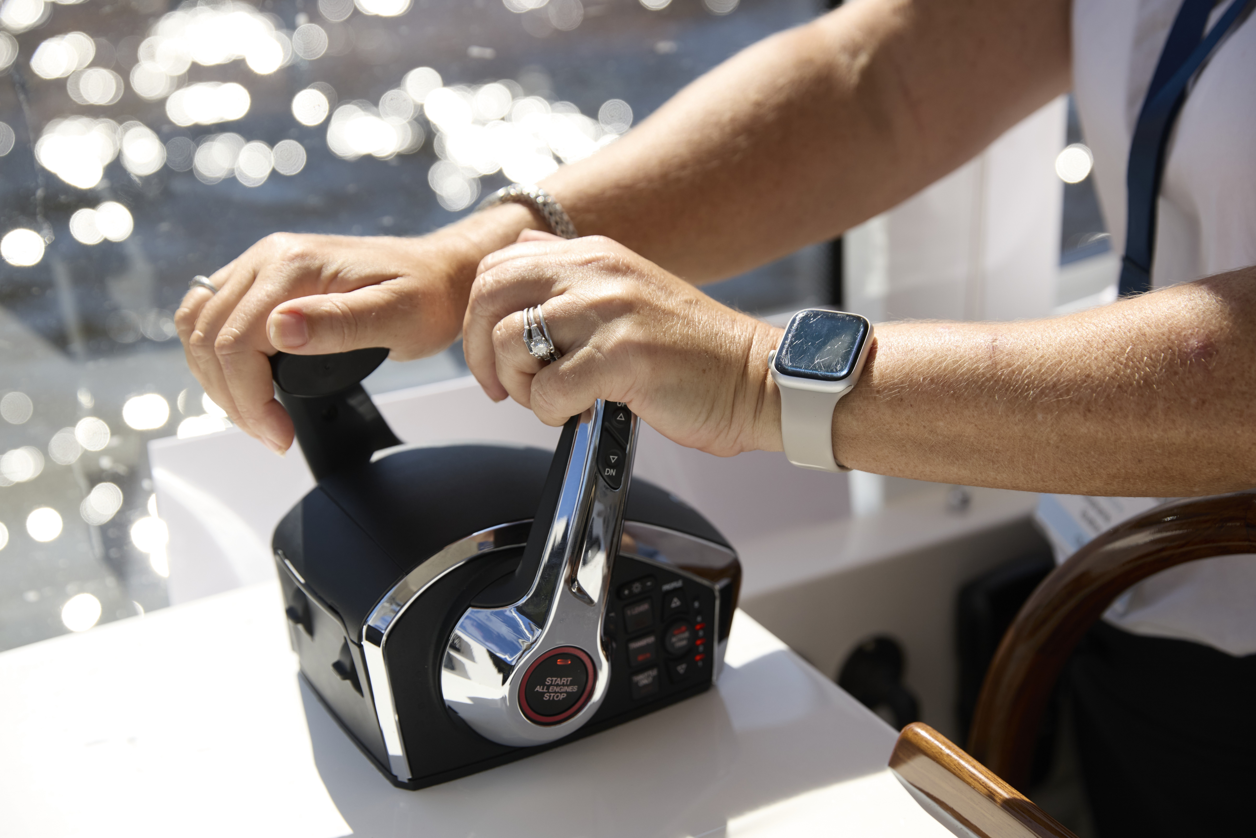 Woman confidently captaining an MJM yacht