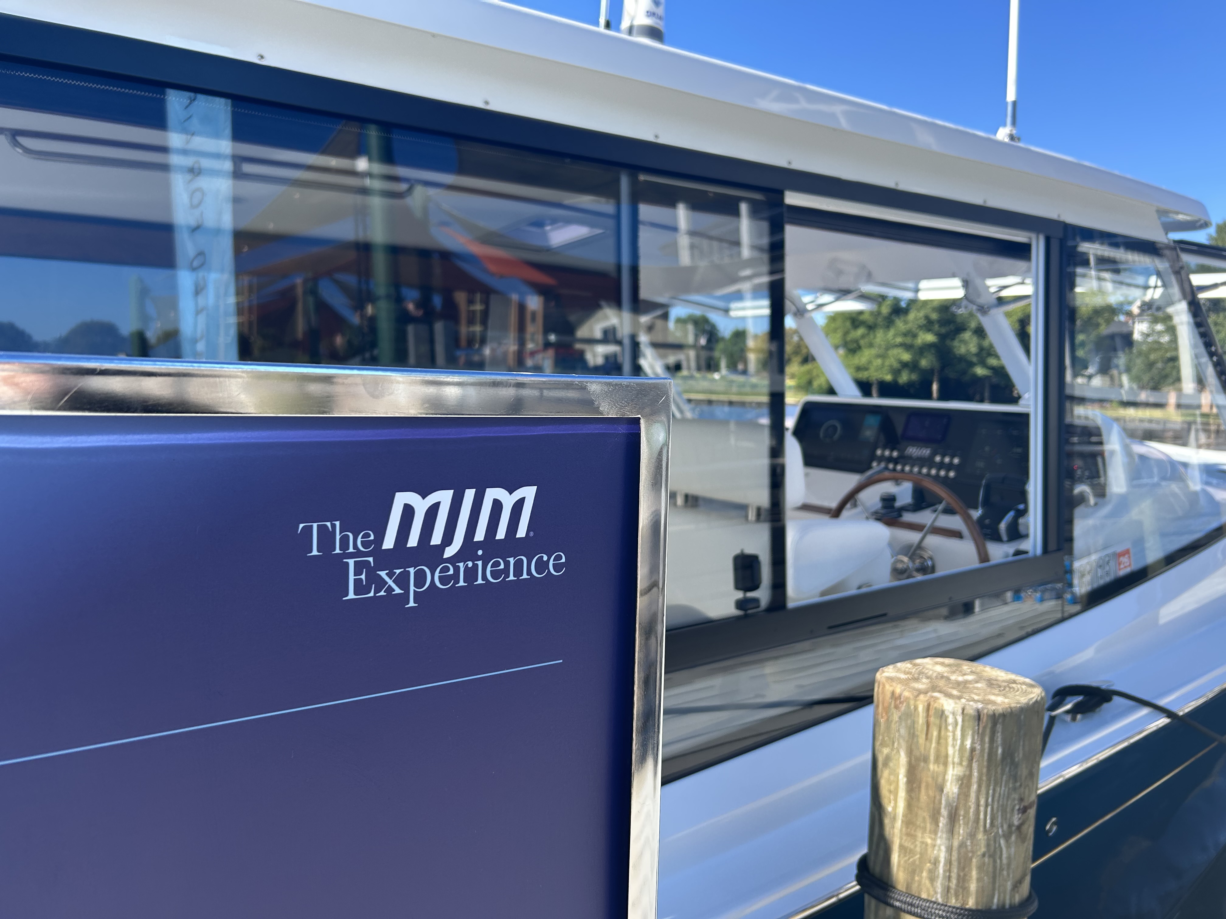 The MJM Experience banner on a yacht